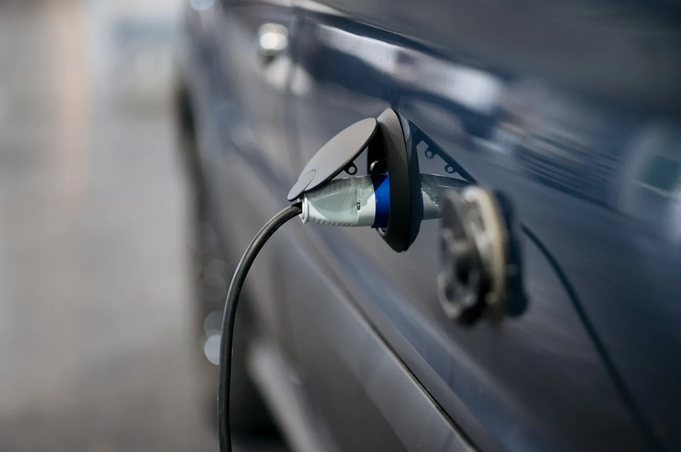 An electric car connected to a public charger; illustrative image, not a Leapmotor B03